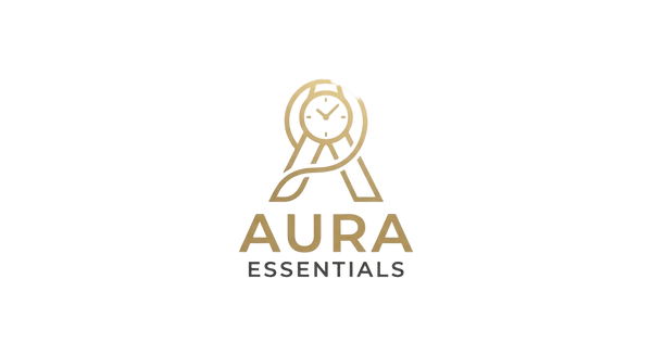 A centered gold and dark gray logo reading AURA ESSENTIALS on a light warm beige textured background.